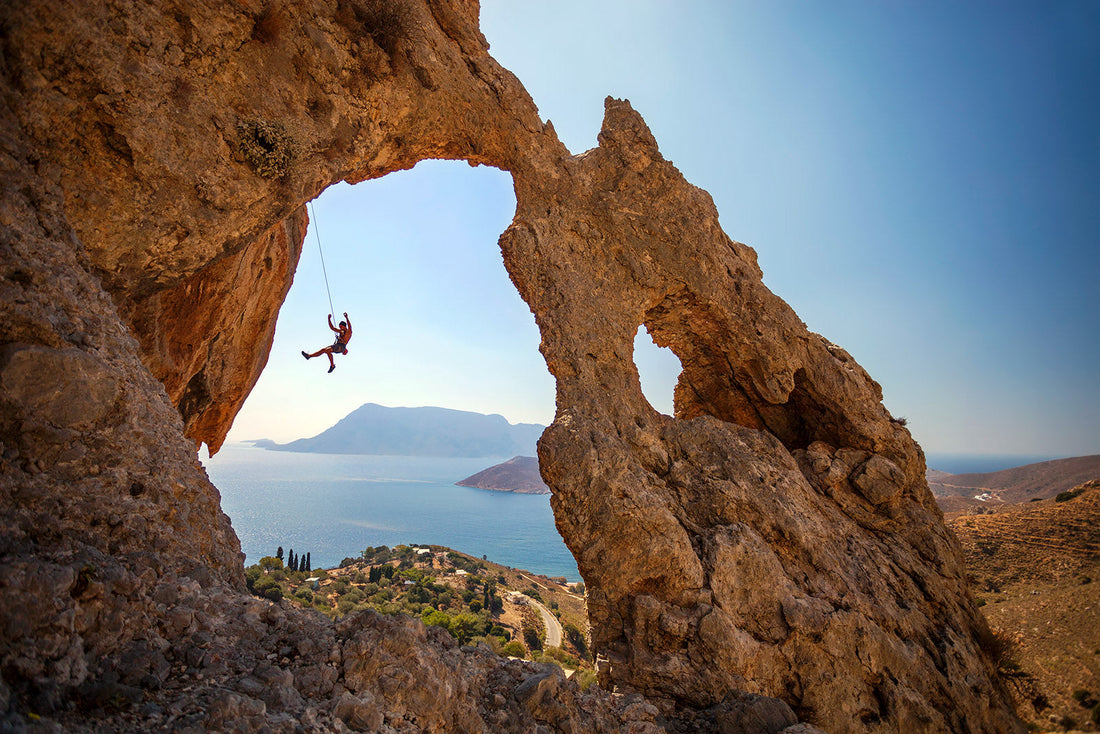 Rock climber falling of a cliff while lead climbing. Kalymnos Island, Greece